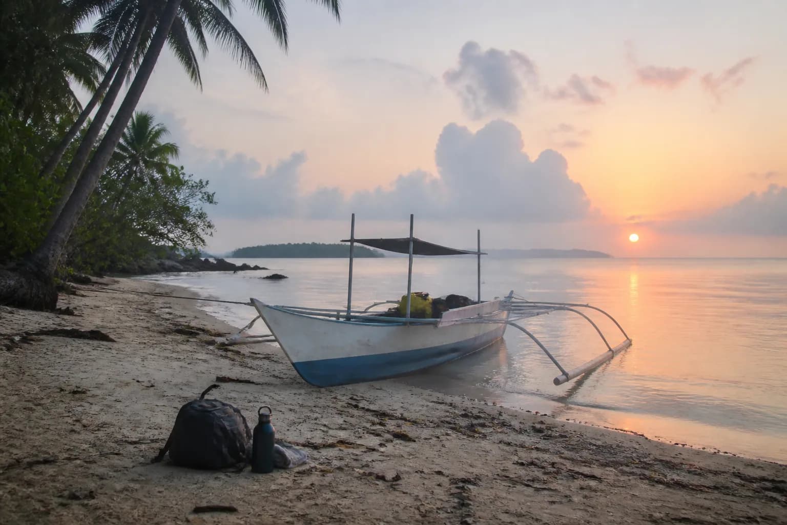 A small boat on a calm Siargao shore
